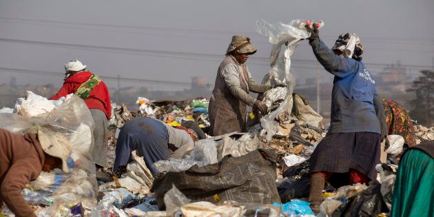 Waste pickers sort through garbage for recycling at a dumpsite in Sasolburg, South Africa.