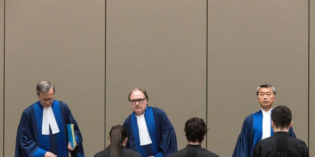 Judge Cuno Tarfusser (C), Judge Chang-ho Chung (R) and Judge Marc Perrin de Brichambautat (L) issue a ruling on South Africa's failure to arrest Sudanese President Omar al-Bashir during a three-day visit in June 2015, during a session of the International Criminal Court in The Hague, Netherlands, July 6, 2017.