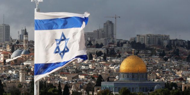 An Israeli flag is seen near the Dome of the Rock, located in Jerusalem's Old City, on the compound known to Muslims as Noble Sanctuary and to Jews as Temple Mount. December 6, 2017.