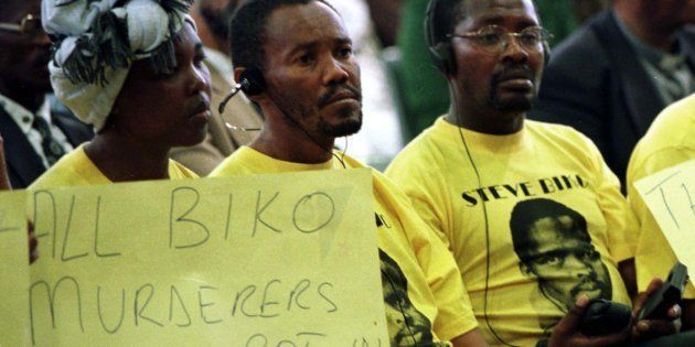 Demonstrators protest against five former security policemen's application for amnesty at the Truth and Reconciliation Commission, in 1997; the policemen were applying for their part in the killing of black consciousness activist Steve Biko. Biko, a leading member of the Black Peoples Convention, died in detention in September 1977. Two years later, the four policemen were all refused amnesty on the grounds including the failure to fully disclose what happened.