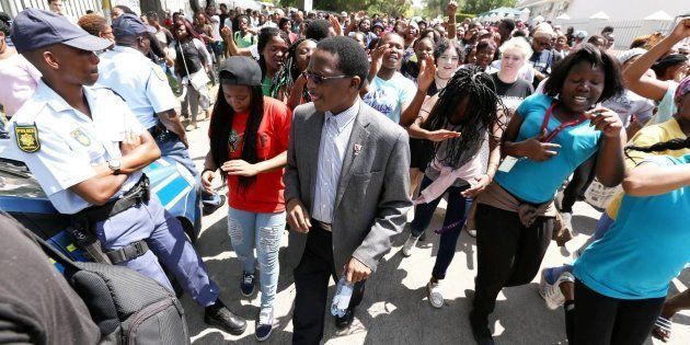 GRAHAMSTOWN, SOUTH AFRICA; OCTOBER 19: Rhodes University vice-chancellor Dr Sizwe Mabizela with students protesting over an increase of tuition fees.