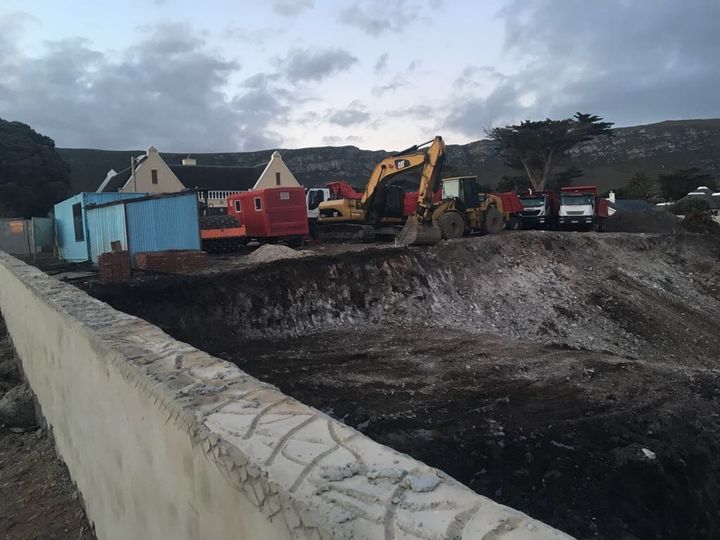 The site office and an excavator in the property in Hermanus where Jooste is buidling an new holiday home.
