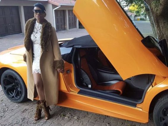 Khosi Madzonga posing next to a Lamborghini in one of the images that have since been removed from Facebook.