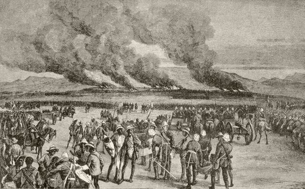 The burning of the Zulu royal kraal at Ulundi after the battle of Ulundi. From Afrika, dets Opdagelse, Erobring og Kolonisation, published in Copenhagen, 1901.