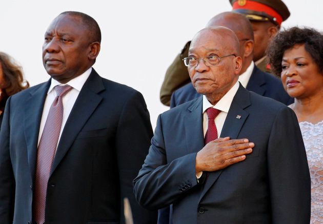 South Africa's Deputy President Cyril Ramaphosa (L) and President Jacob Zuma listen to the national anthem at the opening of Parliament in Cape Town, South Africa February 11, 2016. REUTERS/Mike Hutchings/File Photo