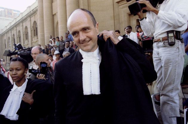 South African President Nelson Mandela's lawyer Wim Trengove smiles as he leaves the Rand Supreme Court in Johannesburg March 19. A judge granted his request for an end to the marriage of Mandela, and his estranged wife Winnie whose "brazen public conduct and infidelity", Trengove said, had humiliated her husband
