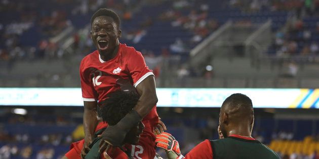 Alphonso Davies celebrates with teammates after scoring during a match between French Guiana and Canada as part of the Gold Cup 2017 on July 7 at Red Bull Arena in New Jersey.