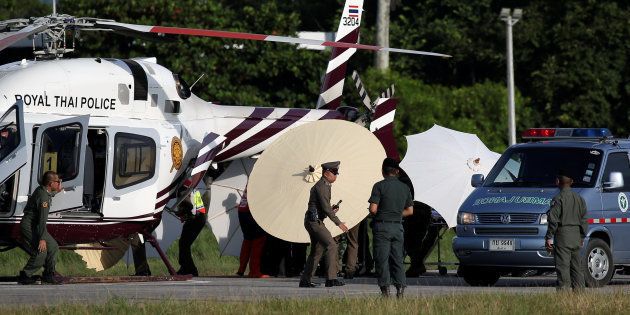 Rescued schoolboys are moved from a Royal Thai Police helicopter to an awaiting ambulance at a military airport in Chiang Rai, Thailand, July 9 2018.