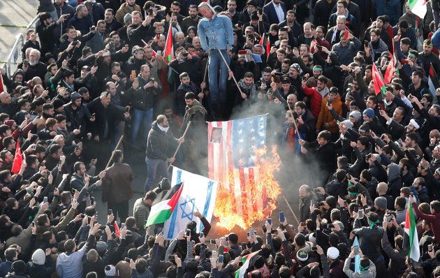 Demonstrators set U.S. and Israeli flags on fire during a protest against U.S. President Donald Trump's recognition of Jerusalem as Israel's capital, in Istanbul, Turkey December 10, 2017.