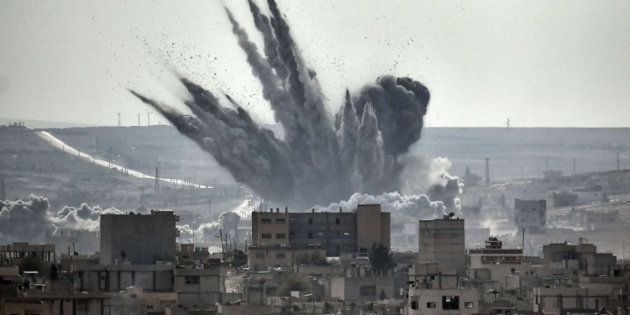 A shell explodes in the Syrian city of Kobane