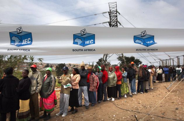 Voters wait for hours in a long queue to cast their ballots during voting in the nationwide election April 22, 2009, in the Sweetla Squatter Camp near Alexandra Township, South Africa.