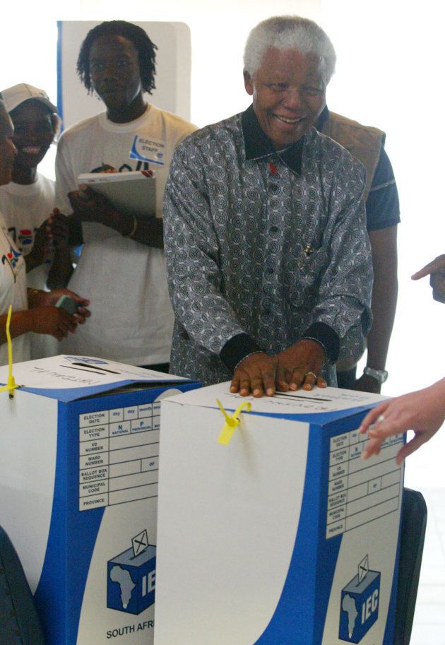 Former South Africa President Nelson Mandela smiles after casting his vote in Johannesburg, April 14, 2004. Juda Ngwenya/ DL/ REUTERS