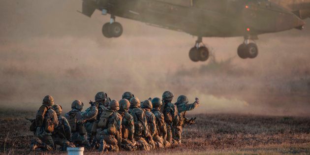 South African National Defence Force personnel take part in a military training exercise at Roodewal Airforce base in Limpopo on June 1, 2017.