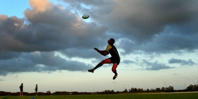 South Africa's Ashwin Willemse takes a high ball during a trainingsession in Brisbane, October 27, 2003. Saturday.