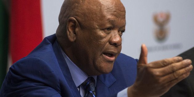 Jeff Radebe, South Africa's minister of the presidency, gestures as he speaks during a news conference ahead of the mid-term budget speech in Cape Town, South Africa, on Wednesday, Oct. 26, 2016. While South Africa's Finance Minister Pravin Gordhan forecast in February that the economy would grow 0.9 percent this year, soft commodity prices, a lackluster global economy and a crippling drought have put that target beyond reach. Photographer: Waldo Swiegers/Bloomberg via Getty Images