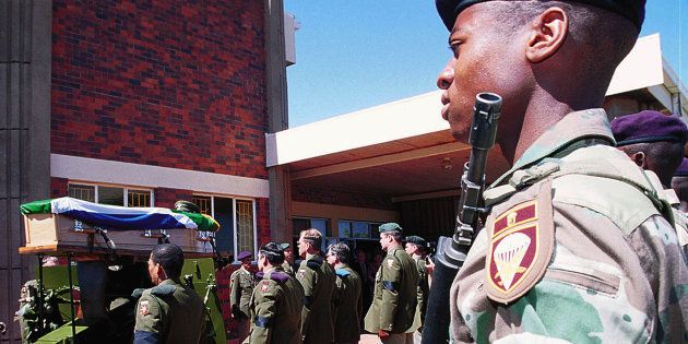 Soldiers from the Tempe Military Base in Bloemfontein stand guard at the funeral of Major Jaques Coetzer, September 21.