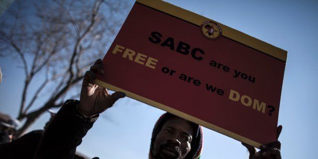 A Protester rallies with others outside the Constitutional Court on July 1, 2016 in Johannesburg to protest against alleged bias and self-censorship in news coverage by the South African Broadcasting Corporation (SABC) ahead of key municipal elections.