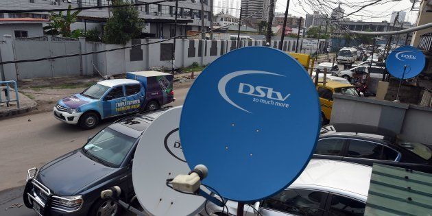 A picture shows MultiChoice's digital satellite TV dishes installed on homes and offices in Lagos, on March 8, 2016.