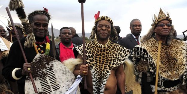 SOWETAN VIA GETTY IMAGES Prince Mangosuthu Buthelezi and Jacob Zuma with Zulu King Goodwill Zwelithini during one of the monarch's weddings at Ondini Sports Complex on July 26 2014, in Ulundi.