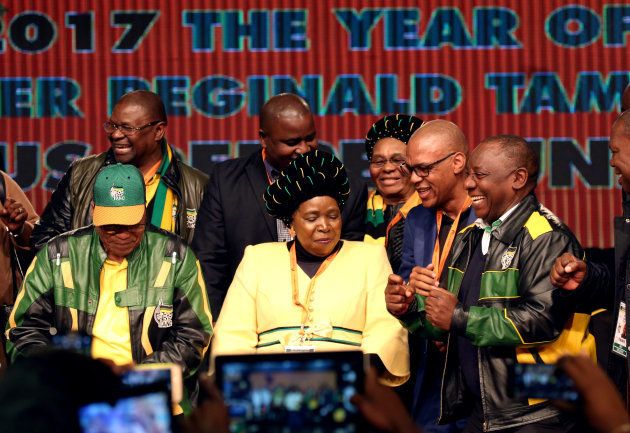 South Africa's President Jacob Zuma dances with former African Union chairperson Nkosazana Dlamini-Zuma and South Africa's Deputy President Cyril Ramaphosa.