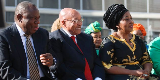 President Jacob Zuma is flanked by his wife Bongi Ngema-Zuma and deputy president Cyril Ramaphosa during the national Women's Day celebrations at the Union Buildings on August 09, 2016 in Pretoria.