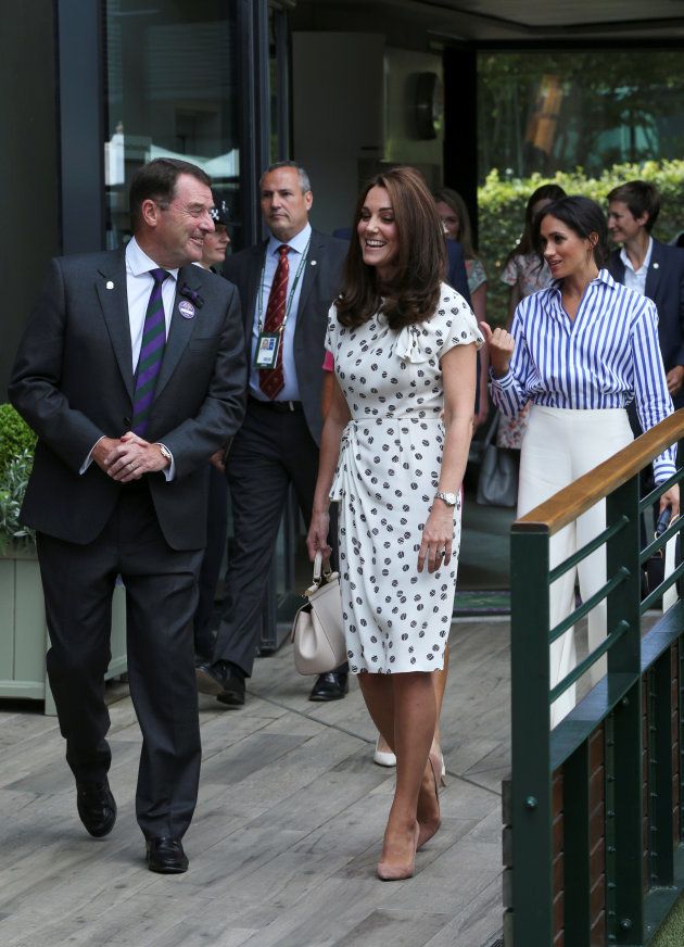 Chairman of the AELTC Philip Brook welcomes Britain's Catherine, the Duchess of Cambridge and Meghan the Duchess of Sussex, to the Wimbledon Championships at the All England Lawn Tennis and Croquet Club, Wimbledon, London, on Saturday.
