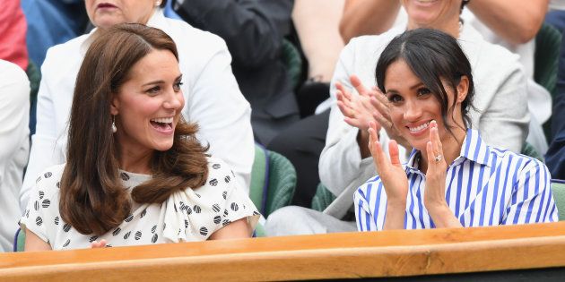 Catherine, Duchess of Cambridge, and Meghan, Duchess of Sussex, attend day twelve of the Wimbledon Tennis Championships at the All England Lawn Tennis and Croquet Club on Saturday in London.