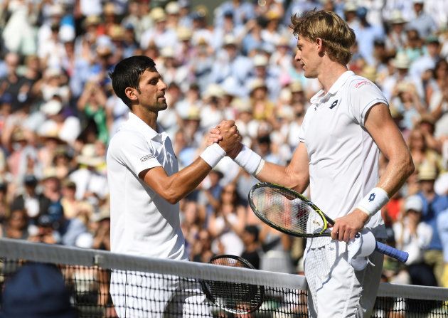 Tennis - Wimbledon - All England Lawn Tennis and Croquet Club, London, Britain - July 15, 2018 Serbia's Novak Djokovic meets South Africa's Kevin Anderson at the net after defeating him in the men's singles final . Neil Hall/Pool via Reuters