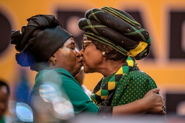 Winnie Madikizela-Mandela and Dlamini-Zuma greet each other as they attend the 54th ANC National Conference at the Nasrec Expo Centre in Johannesburg on December 16, 2017.