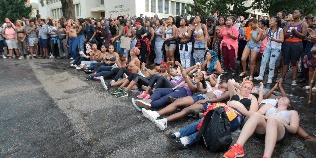 Rhodes University students lay on their backs during protests against sexual violence in the institution on April 19, 2016 in Grahamstown, South Africa. This comes after the names of 11 students accused of rape were posted on social media.