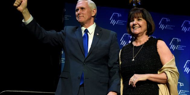 U.S. Vice President Mike Pence, left, and his wife, Karen Pence acknowledge the audience before he speaks at the Republican Jewish Coalition's annual meeting in Las Vegas, Nevada February 24, 2017.