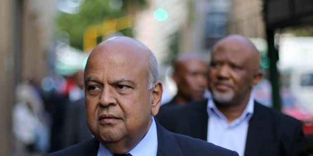 South Africa's Finance Minister Pravin Gordhan walks with his deputy, Mcebisi Jonas as they walk from their offices to a court hearing in Pretoria, South Africa, March 28,2017.