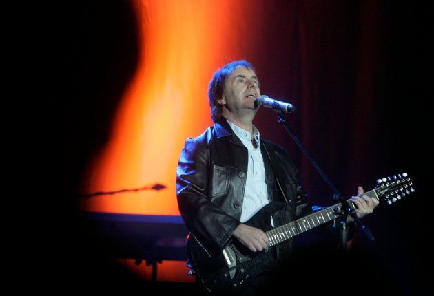 Singer Chris de Burgh performs onstage.