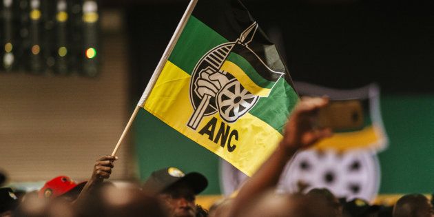 A delegate waves an ANC flag during a speech by Jacob Zuma, South Africa's president, not pictured, at the 54th national conference of the African National Congress party (ANC) in Johannesburg, South Africa, on Saturday, Dec. 16, 2017.