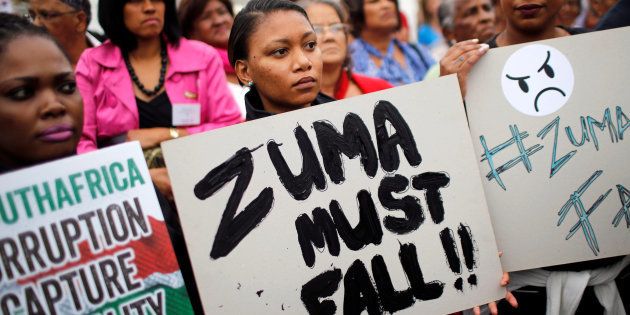 Demonstrators protest against South African President Jacob Zuma's firing of Finance Minister Pravin Gordhan, outside Parliament in Cape Town, South Africa, March 31, 2017.