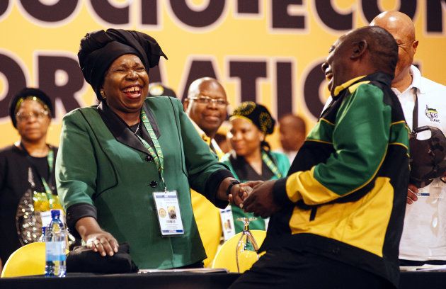 Nkosazana Dlamini-Zuma, presidential candidate of the African National Congress party (ANC), left, reacts with Cyril Ramaphosa, South Africa's deputy president, during the 54th national conference of the African National Congress party (ANC) in Johannesburg, South Africa, on Saturday, Dec. 16, 2017. South Africa's president Jacob Zuma urged the ruling African National Congress to fight factionalism and consider accommodating members of rival slates in its new leadership that will be elected at its national conference. Photographer: Waldo Swiegers/Bloomberg via Getty Images