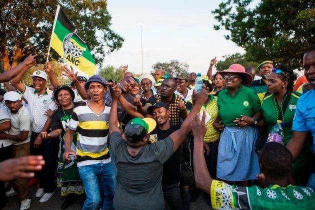 Supporters of Cyril Ramaphosa, South African Deputy President and presidential hopeful of the African National Congress dance outside NASREC Expo Centre during the 54th ANC National Conference in Johannesburg, on December 17, 2017. South Africa's ruling African National Congress holds its 54th national conference, with the party expected to elect its new leader, who will probably become the country's next president. / AFP PHOTO / WIKUS DE WET (Photo credit should read WIKUS DE WET/AFP/Getty Images)