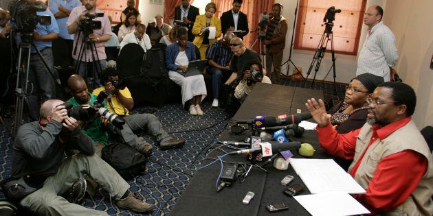 ANC secretary-general Gwede Mantashe (R) addresses the media in Kempton Park, outside Johannesburg, on September 20, 2008, announcing the recall of President Thabo Mbeki.