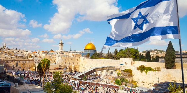 Israel flag with a view of old city Jerusalem and the KOTEL- Western wall