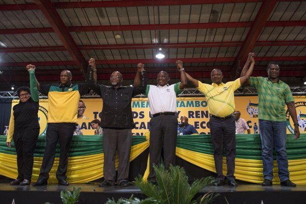JOHANNESBURG, SOUTH AFRICA - DECEMBER 18: Cyril Ramaphosa (C) celebrates after he was elected as ANC's new party leader during African National Congress (ANC) at the Nasrec Expo Center in Johannesburg, South Africa on December 18, 2017. (Photo by Ihsaan Haffejee/Anadolu Agency/Getty Images)