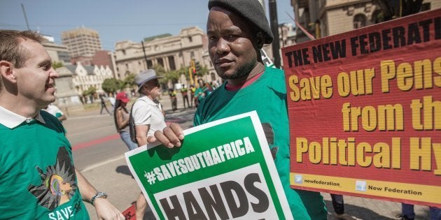 Save SA organisation, unions and other civil society groups members demonstrate in support of axed Finance minister Pravin Gordhan outside the Treasury.