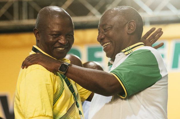 Cyril Ramaphosa, South Africa's deputy president and newly elected president of the ANC (R) embraces David Mabuza, newly appointed deputy president of the ANC, during the 54th national conference of the party in Johannesburg, South Africa, on Monday, Dec. 18, 2017.