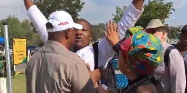 Journalist Sam Mkokeli gets reprimanded by a security guard at the ANC National Conference in Johannesburg.