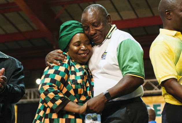 Cyril Ramaphosa, South Africa's deputy president and newly elected president of the African National Congress party (ANC), right, embraces opponent Nkosazana Dlamini-Zuma during the 54th national conference of the African National Congress party in Johannesburg, South Africa, on Monday, Dec. 18, 2017.