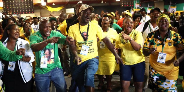 ANC members celebrate after Cyril Ramaphosa was elected president of the ANC during the 54th National Conference of the ruling ANC at the Nasrec Expo Centre in Johannesburg, South Africa December 18, 2017.