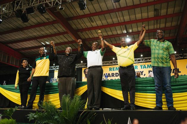 Cyril Ramaphosa, South Africa's deputy president and newly elected president of the African National Congress party (ANC), center, gestures on stage during the 54th national conference of the African National Congress party in Johannesburg, South Africa, on Monday, Dec. 18, 2017. With his election as leader of the ruling African National Congress on Monday, Ramaphosa, 65, will be the party's presidential candidate in 2019 and may take over running the country fromï¿½Jacob Zumaï¿½sooner than that if he's ousted before the end of his second term. Photographer: Waldo Swiegers/Bloomberg via Getty Images