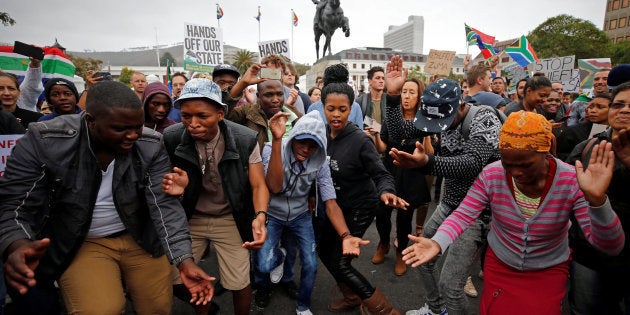 Demonstrators protest against South African President Jacob Zuma's firing of Finance Minister Pravin Gordhan, outside Parliament in Cape Town, South Africa, March 31, 2017.