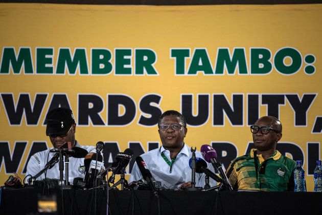 Minister of Police Fikile Mbalula (C) addresses the media, flanked by Minister of Arts and Culture Nathi Mthethwa (L) and African National Congress (ANC) Spokesperson Zizi Kodwa, on the final day of the ANC's 54th National Conference in Johannesburg on December 20, 2017.