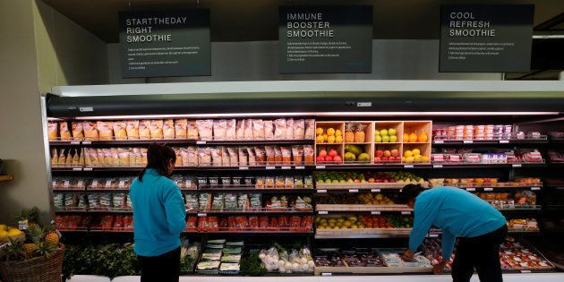 Workers pack fruit at an outlet of retailer Shoprite Checkers in Cape Town, South Africa, June 15, 2017.