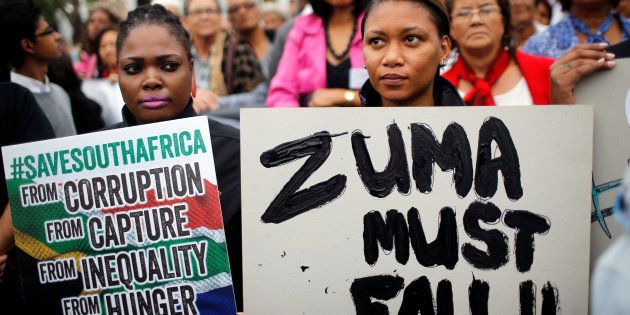 Demonstrators protest against South African President Jacob Zuma's firing of Finance Minister Pravin Gordhan, outside Parliament in Cape Town, South Africa, March 31, 2017. REUTERS/Mike Hutchings